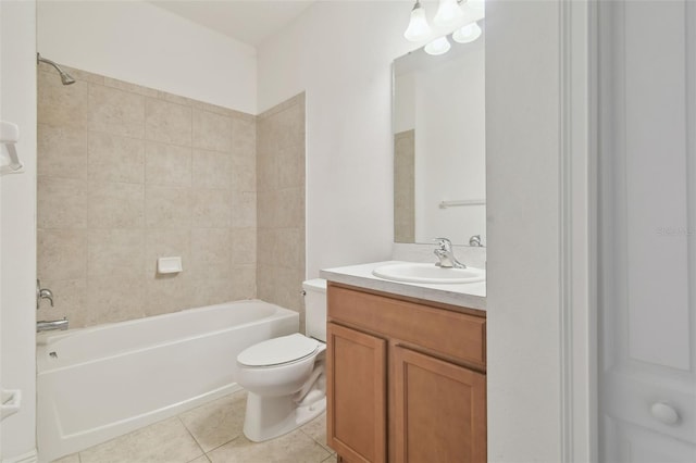 full bathroom with tiled shower / bath, vanity, toilet, and tile patterned flooring