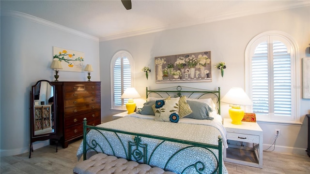 bedroom with multiple windows, crown molding, light hardwood / wood-style floors, and ceiling fan