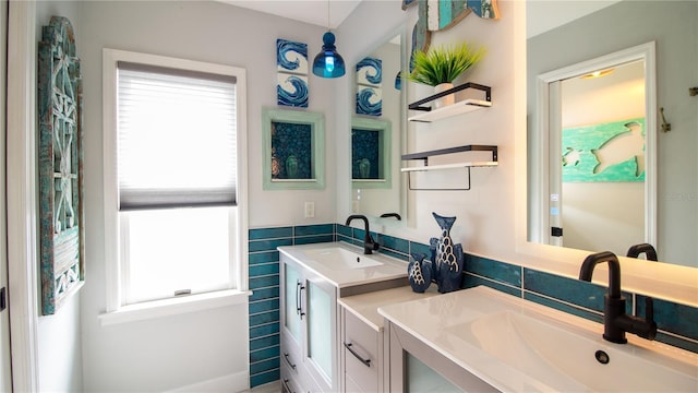 bathroom with vanity and tile walls