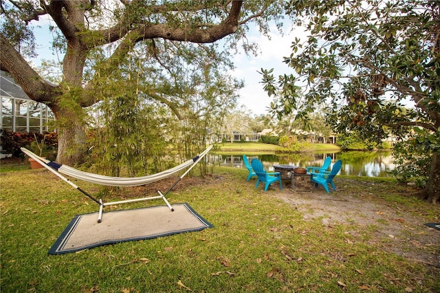 view of jungle gym with a water view and a yard