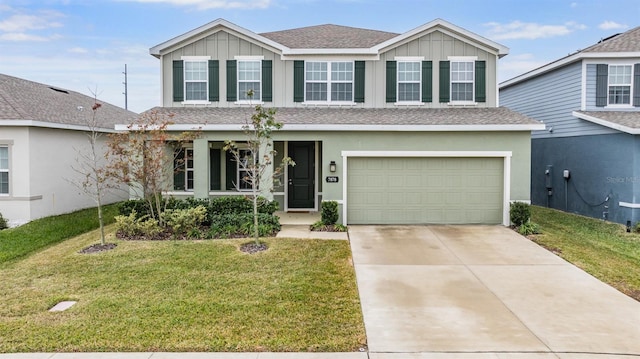 front of property featuring a garage and a front lawn