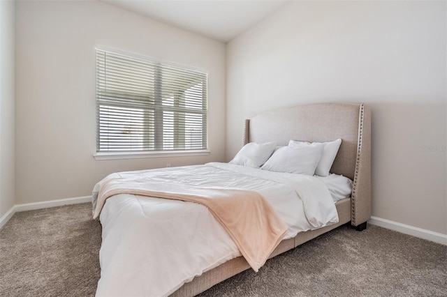 carpeted bedroom featuring vaulted ceiling