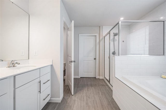 bathroom with vanity and plus walk in shower