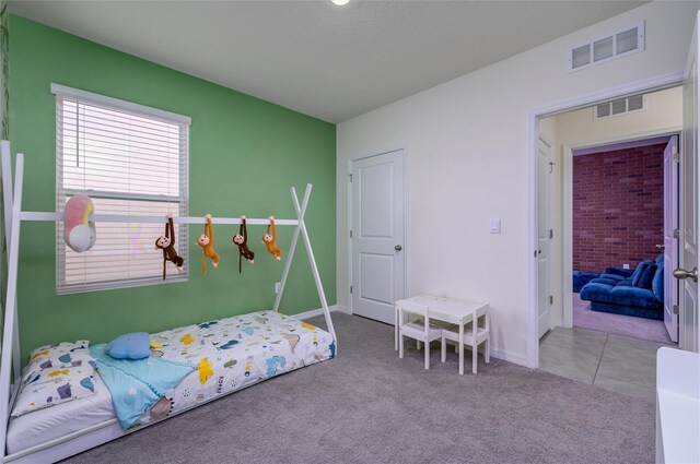 bedroom featuring light carpet