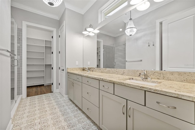 bathroom with walk in shower, vanity, tile patterned flooring, and ornamental molding