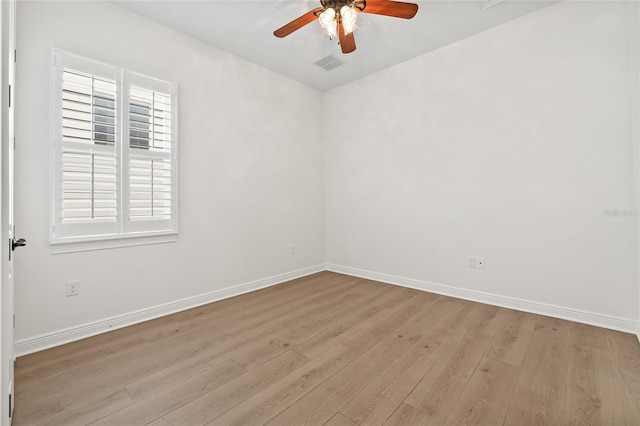 spare room with ceiling fan and light hardwood / wood-style flooring