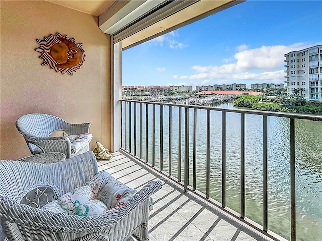 balcony featuring a water view