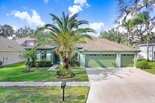 view of front of property featuring a garage and a front lawn