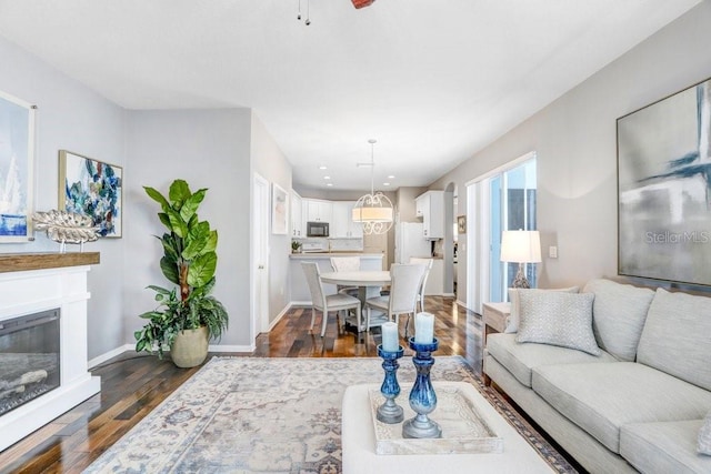 living room featuring dark wood-type flooring