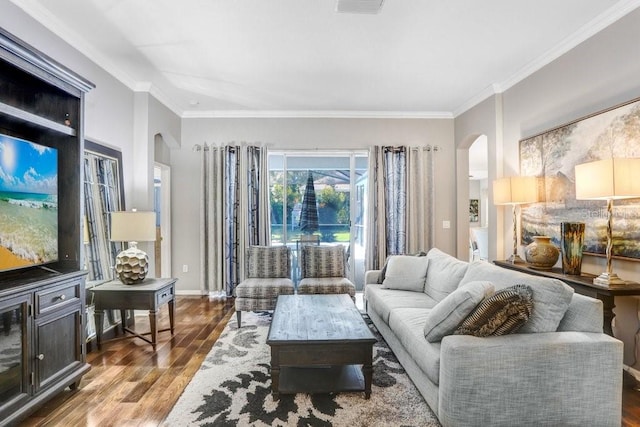 living room featuring hardwood / wood-style flooring and ornamental molding