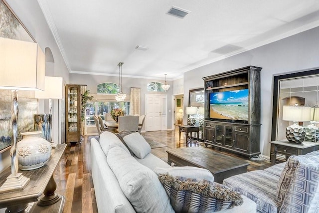 living room featuring crown molding and dark wood-type flooring