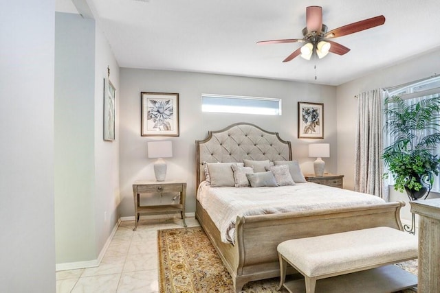 bedroom featuring multiple windows and ceiling fan