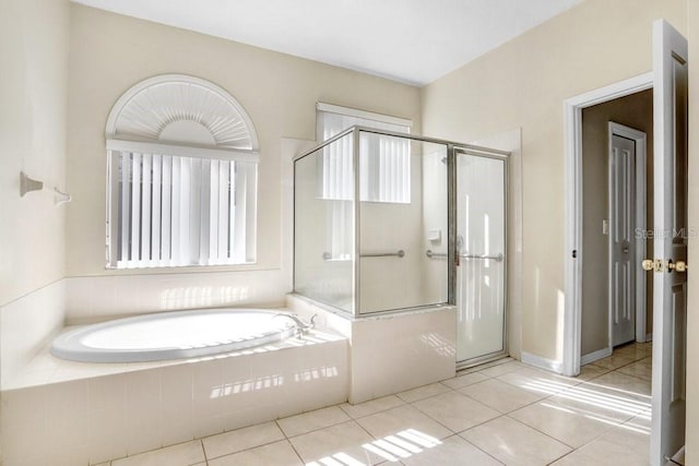 bathroom featuring separate shower and tub and tile patterned flooring