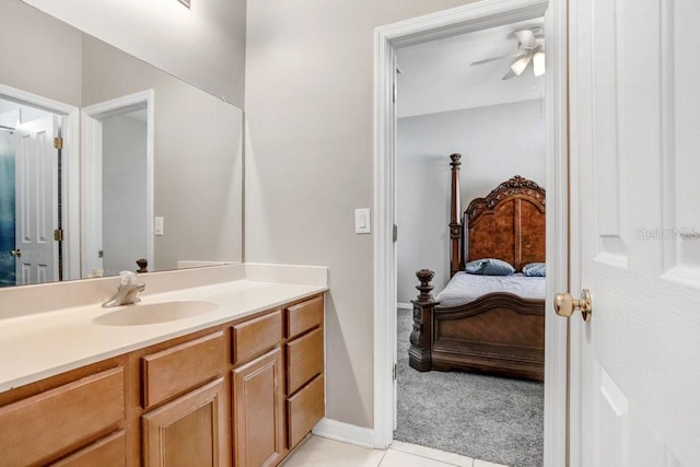 bathroom featuring vanity, tile patterned flooring, and ceiling fan