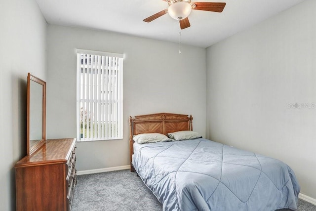 bedroom with light colored carpet and ceiling fan