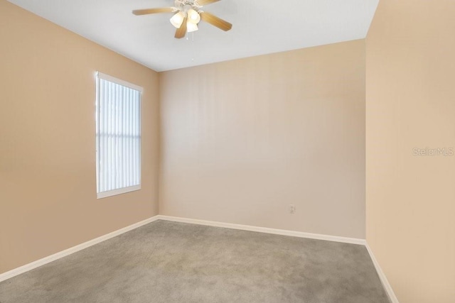 unfurnished room featuring carpet floors and ceiling fan