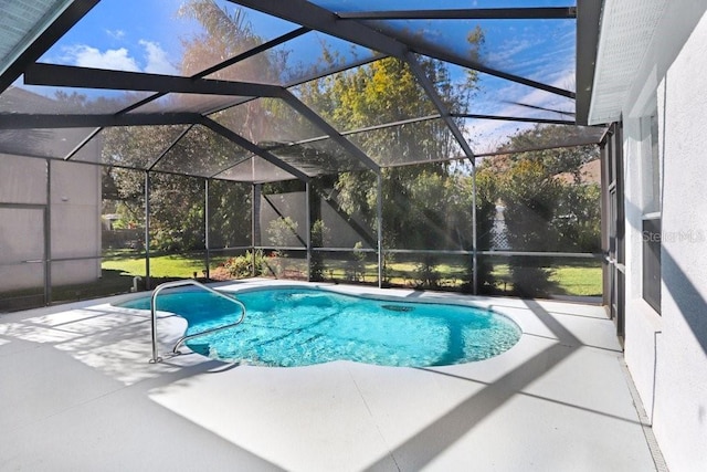 view of pool with a lanai and a patio