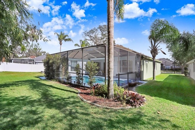 view of yard featuring glass enclosure