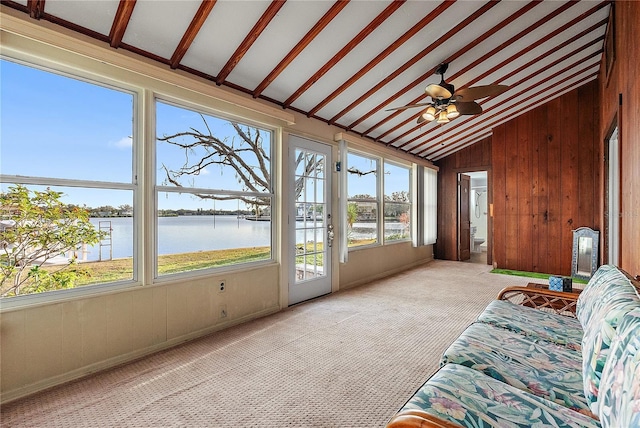 sunroom / solarium with vaulted ceiling, a water view, and ceiling fan