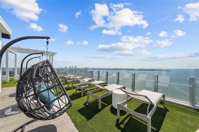 exterior space featuring a water view and a lawn