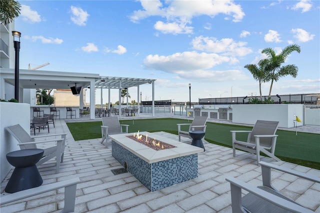 view of patio with an outdoor fire pit, fence, and a pergola