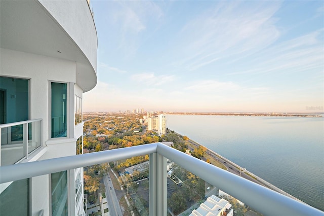 balcony featuring a water view