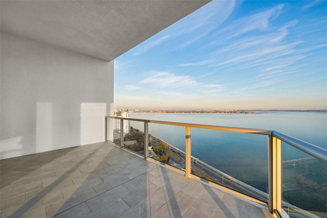 balcony featuring a water view