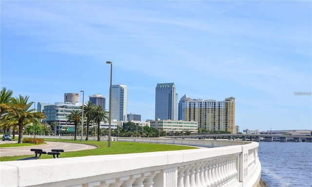 view of property's community with a water view and a city view