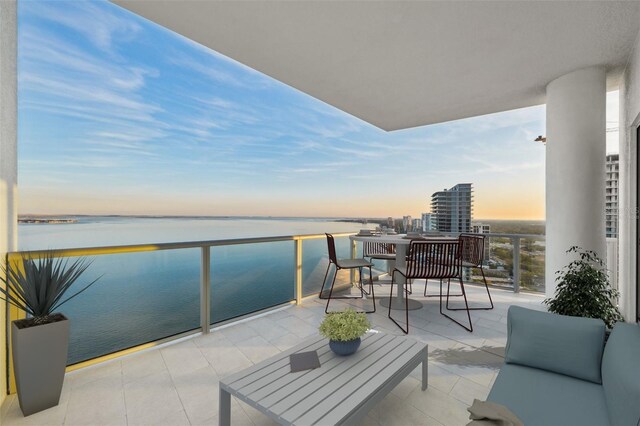 balcony at dusk with a water view