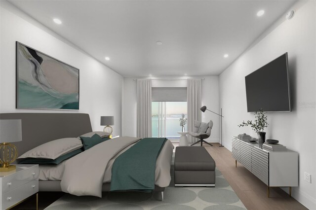 bedroom with wood finished floors and recessed lighting