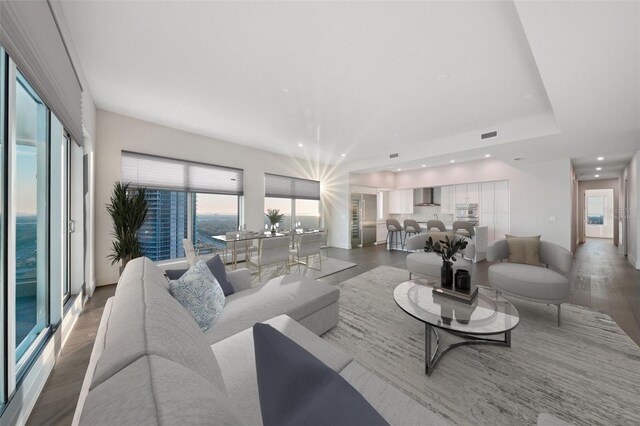 living area with recessed lighting and wood finished floors