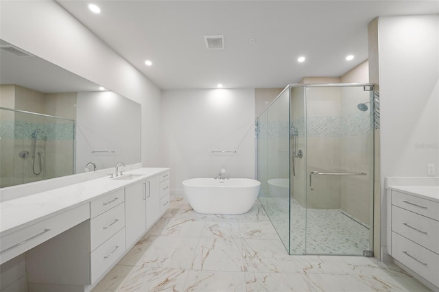 bathroom featuring vanity, a stall shower, recessed lighting, marble finish floors, and a soaking tub