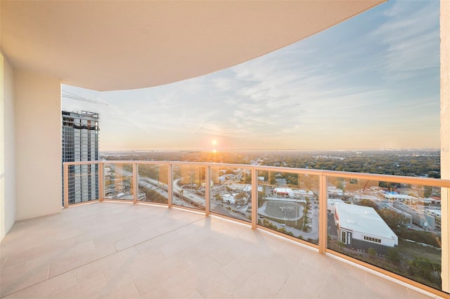 view of balcony at dusk