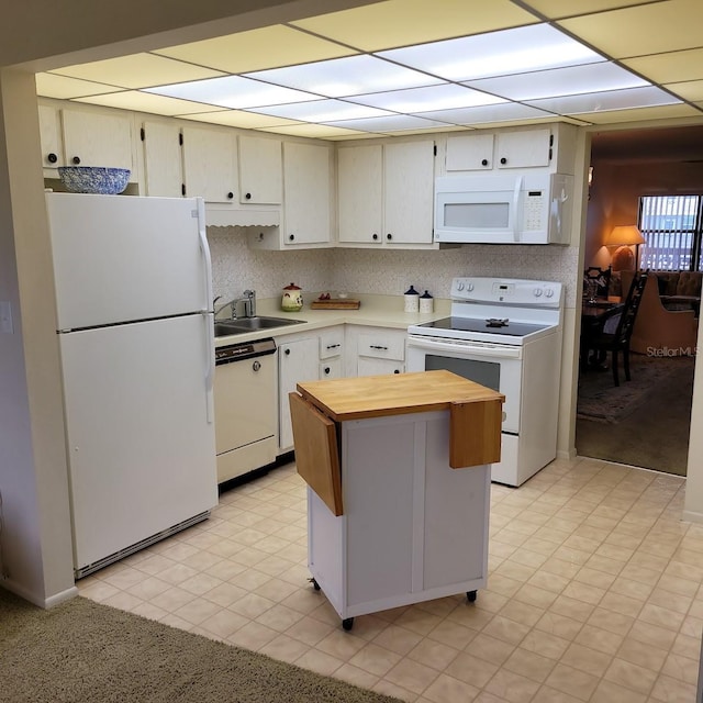 kitchen with sink and white appliances