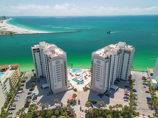 drone / aerial view featuring a water view and a beach view