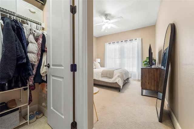 carpeted bedroom with ceiling fan