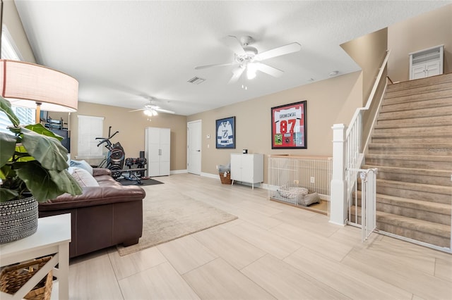 living room featuring ceiling fan