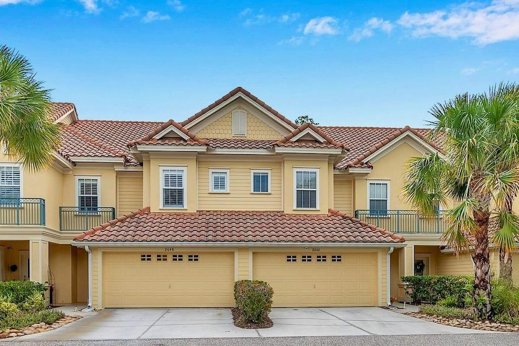 view of front of house with a balcony and a garage