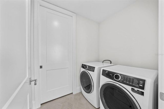 laundry room with separate washer and dryer