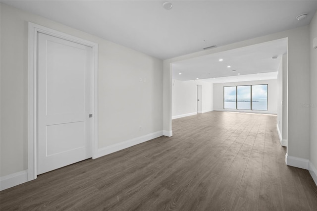 unfurnished room featuring dark hardwood / wood-style flooring