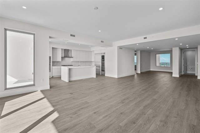 unfurnished living room featuring hardwood / wood-style floors