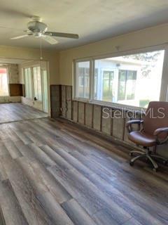 interior space featuring hardwood / wood-style flooring and ceiling fan