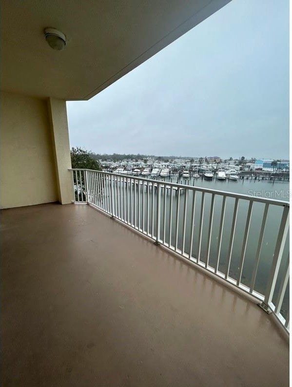 balcony featuring a water view