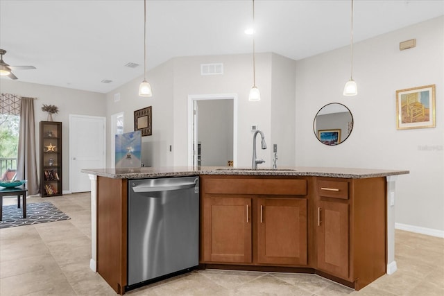 kitchen with decorative light fixtures, a center island with sink, and dishwasher