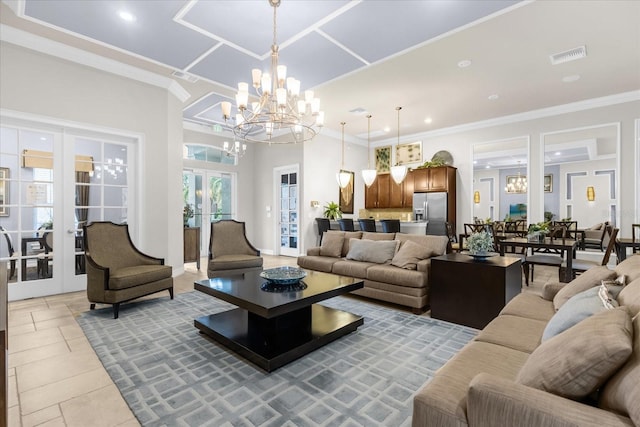 tiled living room with a notable chandelier, french doors, and crown molding