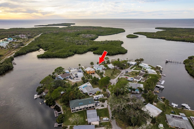 aerial view at dusk with a water view