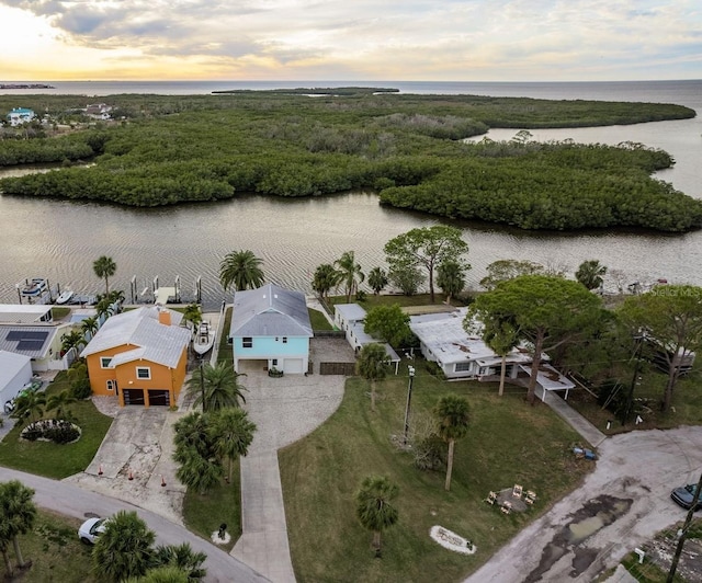 aerial view at dusk with a water view