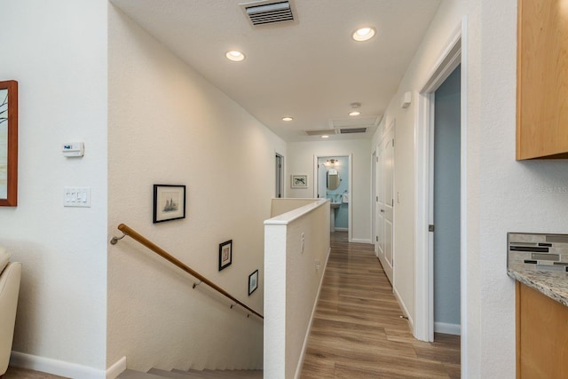 hall with light hardwood / wood-style flooring