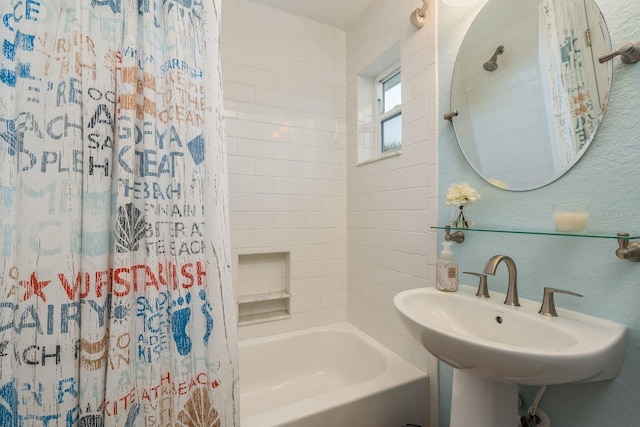 bathroom featuring sink and shower / bath combo with shower curtain