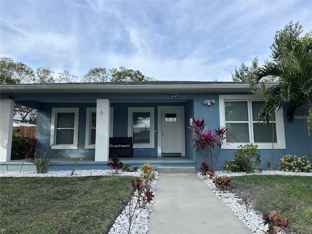 view of front of property with a front lawn and a porch